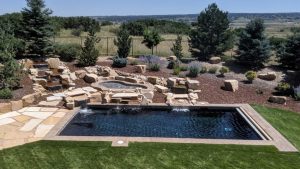 Custom Pool Decking, Waterfall, and Landscaping